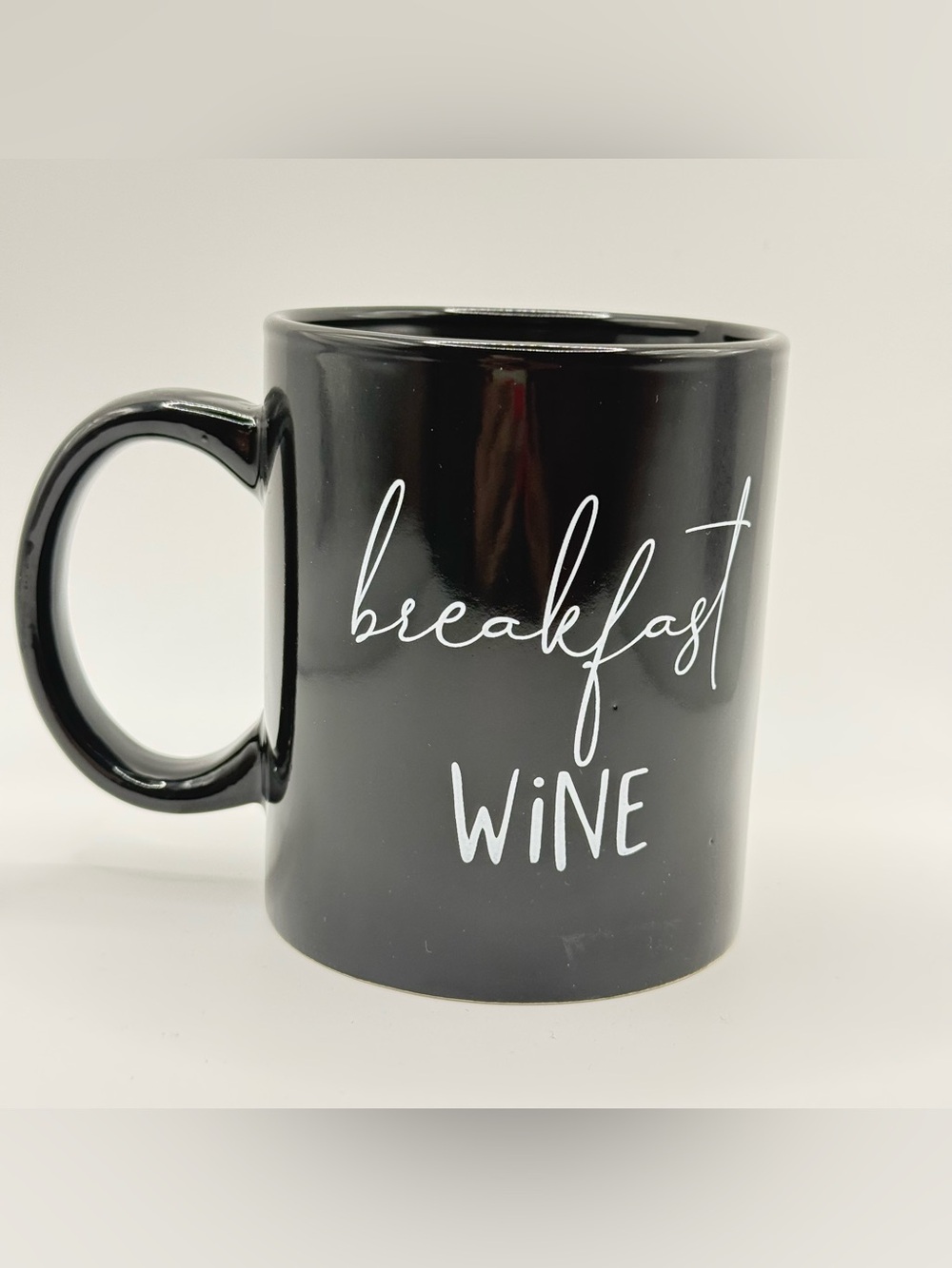 Mainstays Black Ceramic Mug with White "breakfast WiNE" Script